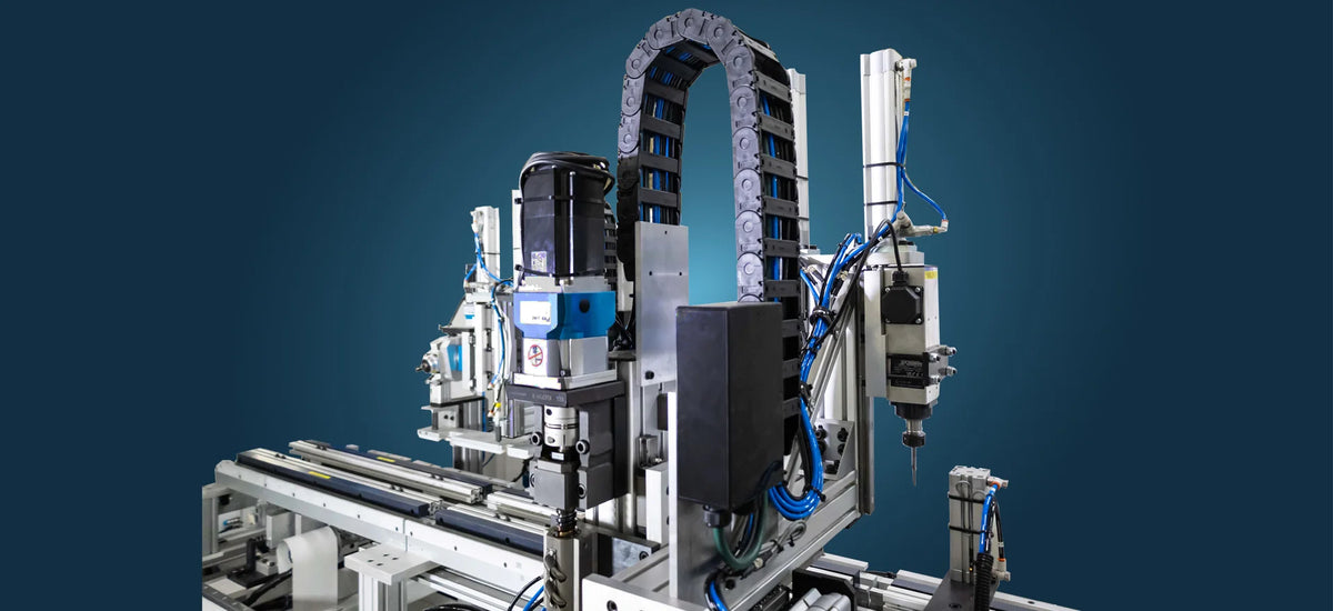 Complex festo cylinders forming a mechanical device with various components on a blue background